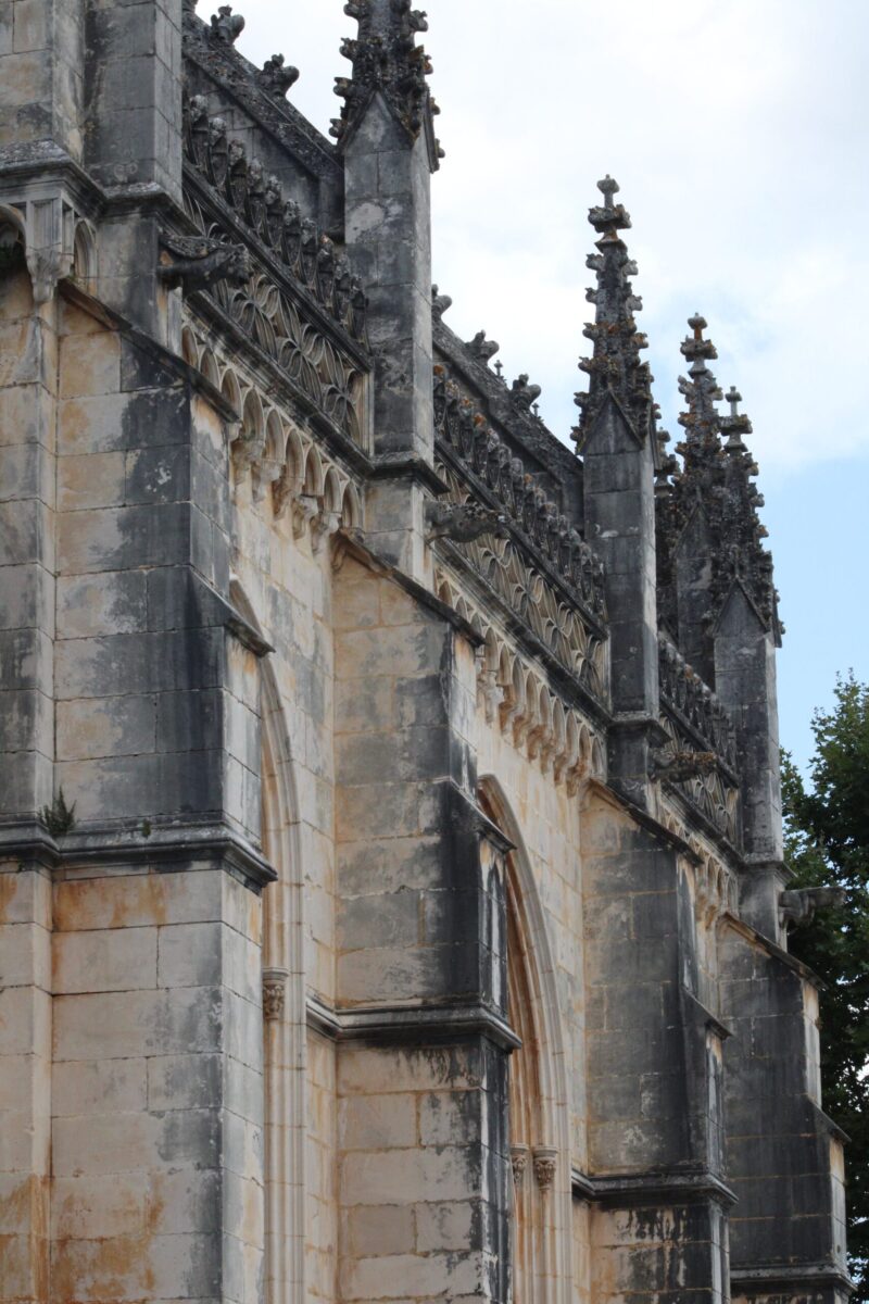 Detailed view of Batalha Monastery's stunning Gothic architecture in Portugal.